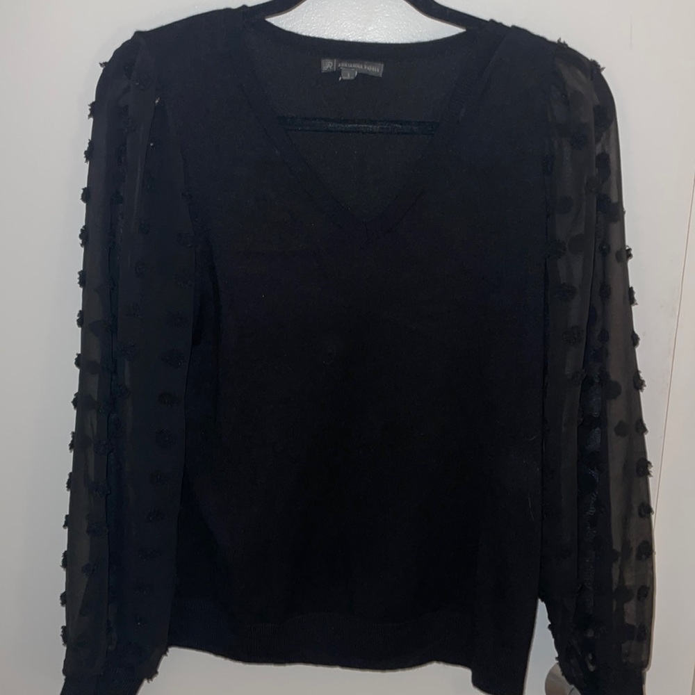 Fun black sweater with sheer sleeves!